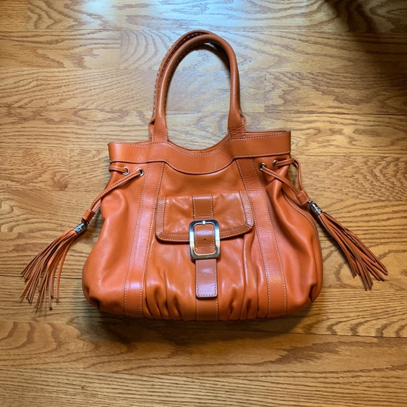 Cole Hahn orange handbag with fringe and silver hardware. - Picture 1 of 16